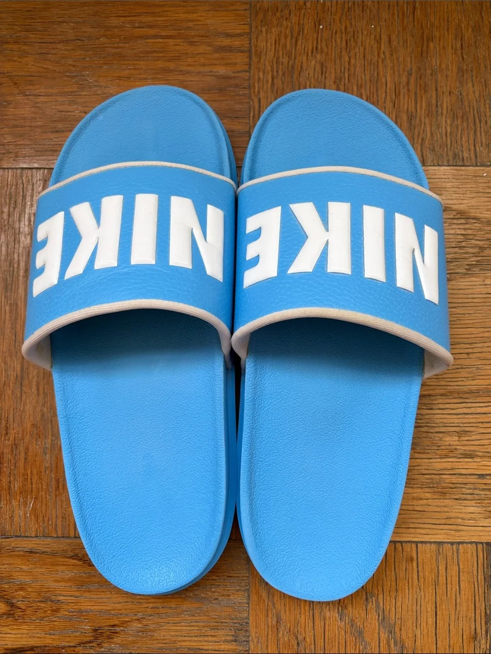 Nike Men’s Light Blue Slide Sandals with White NIKE Logo
